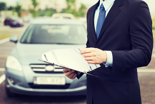 Man reviewing car loan documentation